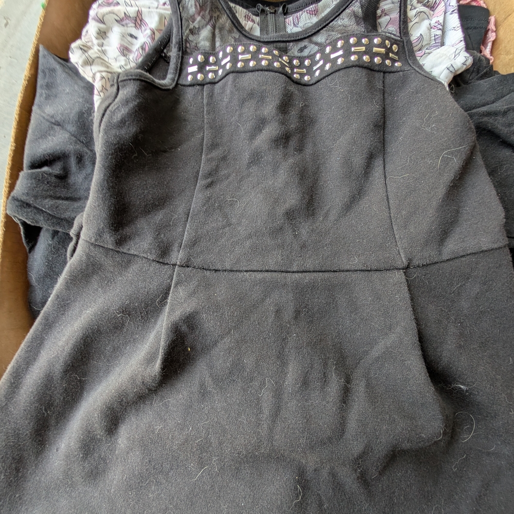 Place Black Garment with Studded Accents